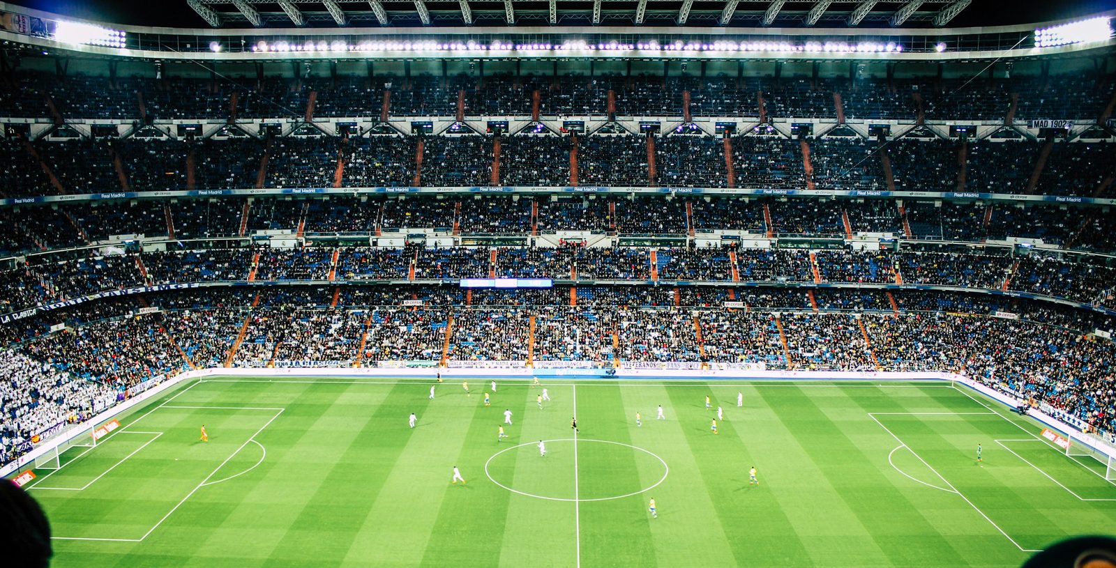 A packed football stadium under floodlights, streamed live on StrimoIPTV